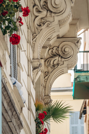 Beautiful Balcony with Red Flowers in the Center of Nice, Franceの写真素材