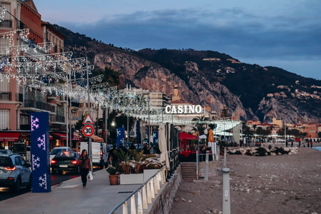Menton, France - 6 January, 2024: Evening view of the city of Menton and its coastal areaのeditorial素材