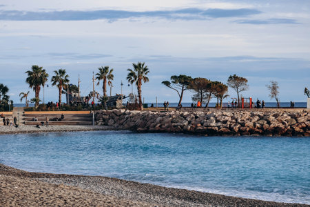 Menton, France - 6 January, 2024: Evening view of the city of Menton and its coastal areaのeditorial素材