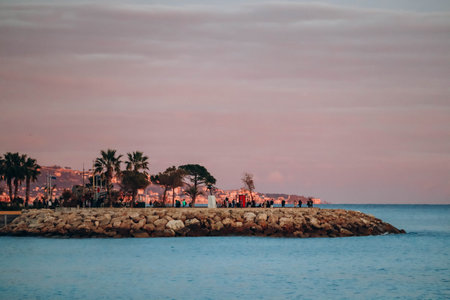 Menton, France - 6 January, 2024: Evening view of the city of Menton and its coastal areaのeditorial素材