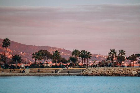 Menton, France - 6 January, 2024: Evening view of the city of Menton and its coastal areaのeditorial素材