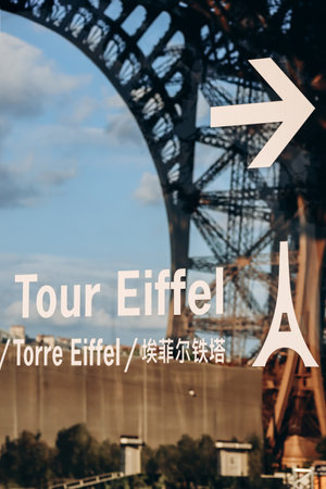 Paris, France - 15 July 2021: Entry indication to the Eiffel Tower during the golden hourのeditorial素材