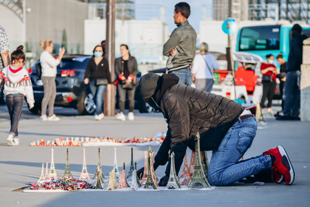 Paris, France - 15 July 2021: Souvenir Eiffel Tower figurine seller in Parisのeditorial素材