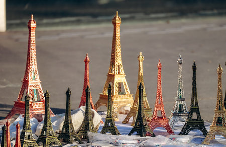 Paris, France - 15 July 2021: Souvenir Eiffel Tower figurines on the pavement in Parisのeditorial素材