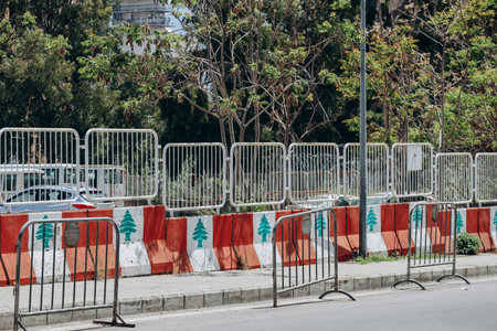 The Lebanese flag displayed on a concrete fence in the center of Beirutの写真素材