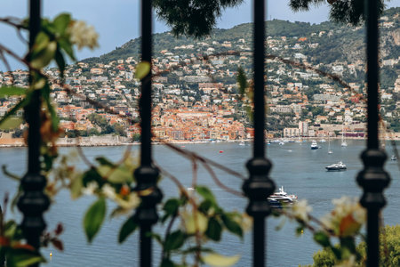 View through the fence of Villefranche-sur-Mer, from the peninsula of Saint-Jean-Cap-Ferratの写真素材