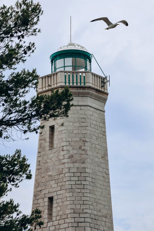 View of the lighthouse on the peninsula of Saint Jean Cap Ferrat in cloudy weather, on the French Rivieraの写真素材