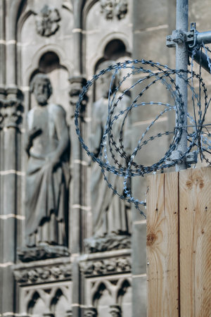 Barbed wire in the foreground of the facade of the cathedral in Clermont Ferrand