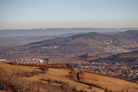 View from Plateau de Gergovie to Clermont-Ferrand suburbs on a winter sunset