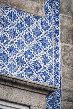 Close-up of a facade in Porto covered with traditional ceramic tiles (azulejos)