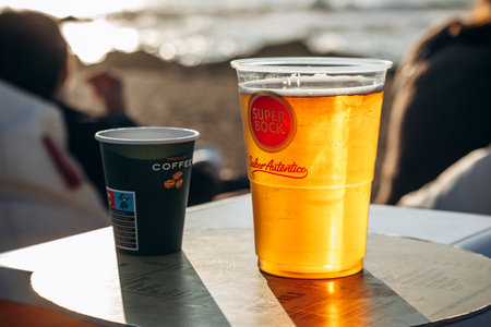 Porto, Portugal - December 28, 2024: Beer and coffee on the oceanfront in Portoのeditorial素材