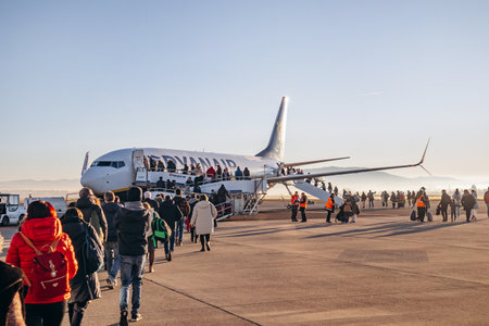 Clermont-Ferrand, France - December 28, 2024: Passengers boarding a Ryanair plane at Clermont-Ferrand Auvergne Airport, preparing for departureのeditorial素材
