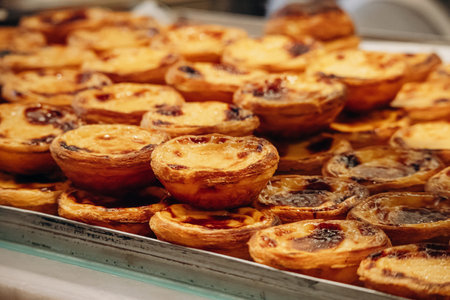 Traditional Portuguese dessert pasteis de nata, served fresh in Lisbonの写真素材