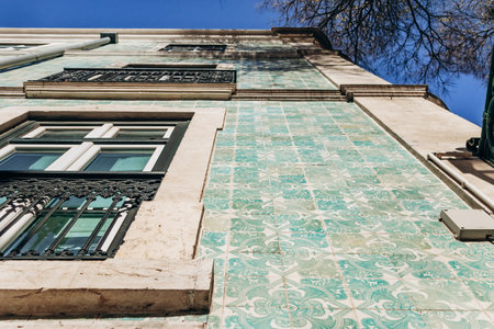 A historic facade in downtown Lisbon covered with iconic azulejo tilesの写真素材