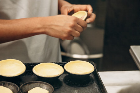 The process of making traditional pasteis de nata in Lisbon, Portugal