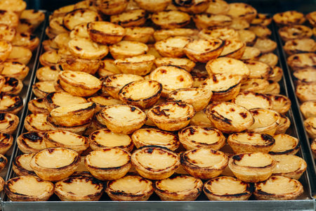 Traditional Portuguese dessert pasteis de nata, served fresh in Lisbon