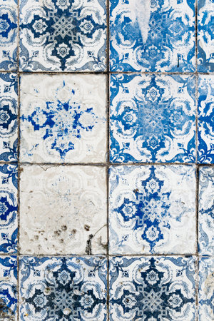 Close-up of traditional azulejo tiles on a historic facade in downtown Lisbon
