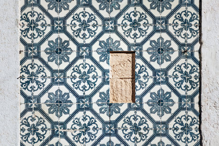 Close-up of traditional azulejo tiles on a historic facade in downtown Lisbon