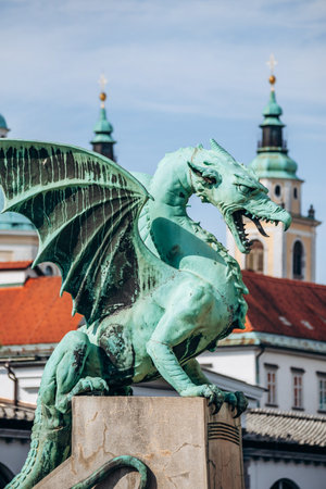 Ljubljana, Slovenia - August 15, 2024: The Dragon Bridge in Ljubljana, an iconic structure crossing the Ljubljanica River, known for its legendary dragon statuesの写真素材