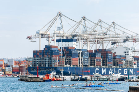 Koper, Slovenia - August 16, 2024: View of the Port of Koper with cargo containers being loaded