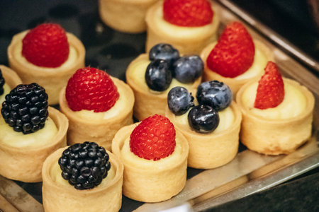 Assorted desserts displayed in the glass showcase of the legendary Caffe San Marco in Triesteの写真素材