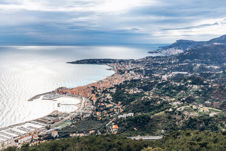View of Menton and Cap Martin from the mountains on the border between France and Italy, showcasing the coastline and surrounding natureの写真素材