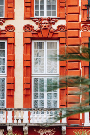 Genoa, Italy - September 22, 2024: Facade of Palazzo Rosso in Genoa, showcasing its vibrant red exterior, ornate details, and historical architectural featuresの写真素材