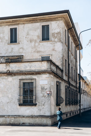 Milan, Italy - March 19, 2025 : Fondazione Prada historic street facade with weathered plaster and entrance gate in Milanのeditorial素材