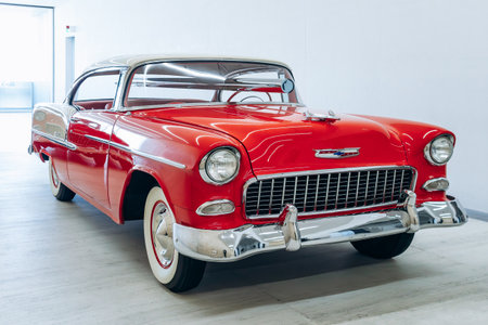 Milan, Italy - March 19, 2025 : Classic red Chevrolet Bel Air vintage car exhibition inside Fondazione Pradaのeditorial素材