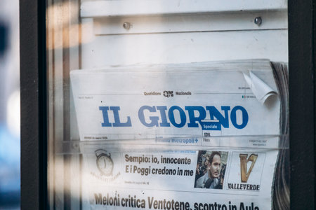 Milan, Italy - March 19, 2025: Il Giorno newspaper displayed at street kiosk in central Milanのeditorial素材