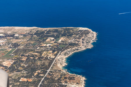 Aerial view of Marfa Ridge and MellieÄ§a region in northern Malta, showing coastal cliffs, fields, and the Mediterranean Seaの写真素材