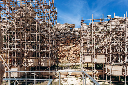 Ancient megalithic Ä ganjtija Temples, a UNESCO World Heritage site on XagÄ ira plateau, featuring massive limestone blocks and original Neolithic stone architecture under a clear spring skyの写真素材
