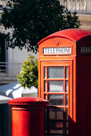 Traditional British red telephone booth and post box in the city center of Valletta, Malta