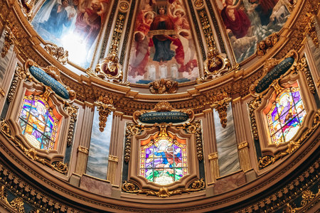Gozo, Malta â April 12, 2025: Interior view of a historical St. Georgeâs Basilica featuring rich artistic decoration, including altarpieces, sculptures, and ornate Baroque elementsのeditorial素材