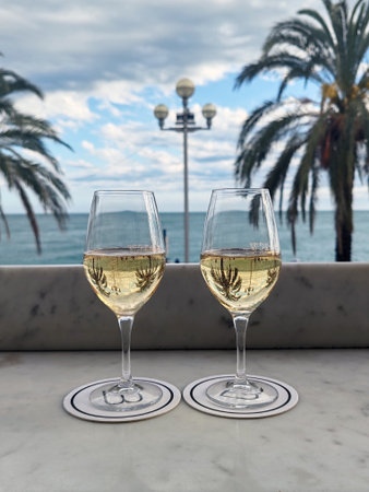 Two glasses of prosecco on terrace overlooking Promenade des Anglaisの写真素材