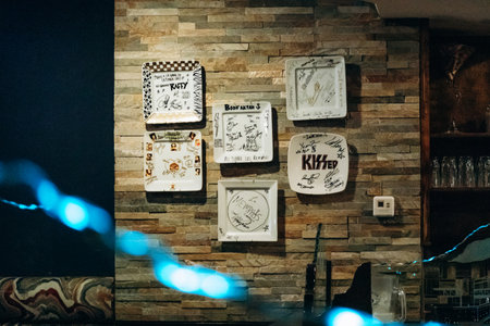 La Tuque, Canada â August 17, 2025: Signed decorative plates displayed on the wall at La Tuque Deli restaurant, featuring autographs of notable visitorsのeditorial素材