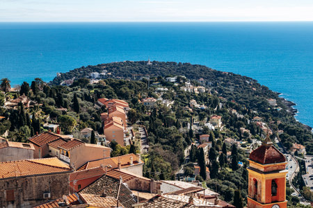 Panoramic view of Roquebrune village rooftops with Sainte Marguerite church bell tower and Cap...