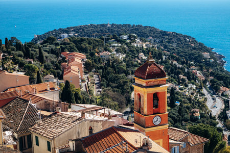 Panoramic view of Roquebrune village rooftops with Sainte Marguerite church bell tower and Cap...