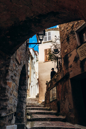 Roquebrune Cap Martin, France - February 9, 2025: Stone arch and staircase in the old town of Roquebrune with traditional housesのeditorial素材