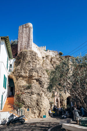 Roquebrune Cap Martin, France - February 9, 2025: View of the medieval Grimaldi Castle seen from Place des Deux Freres in the historic villageのeditorial素材