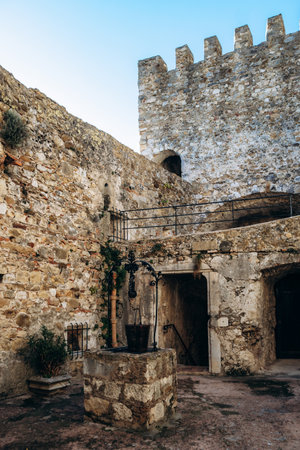 Roquebrune Cap Martin, France - February 9, 2025: Interior courtyard of the medieval Grimaldi Castle with ancient stone well and fortress wallsのeditorial素材