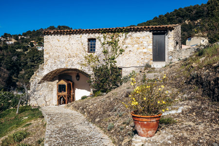 Roquebrune-Cap-Martin, France - February 9, 2025: Historic stone buildings near the Grimaldi Castle on the hilltop of Roquebrune villageのeditorial素材