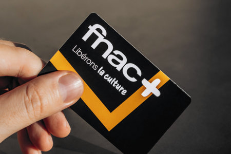 Nice, France - December 9, 2025: Hand holding Fnac loyalty card for cultural products and services in Franceのeditorial素材