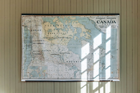 Chambord, Canada - August 18, 2025: Vintage wall map of Canada inside the school building (couvent-ecole) at Val-Jalbert Historical Villageのeditorial素材
