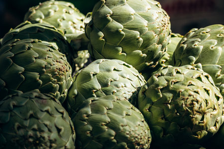 Fresh green artichokes displayed at the Liberation market in Niceの写真素材