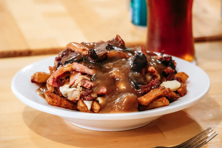 A classic traditional poutine served with golden fries, rich gravy, fresh cheese curds, and added...