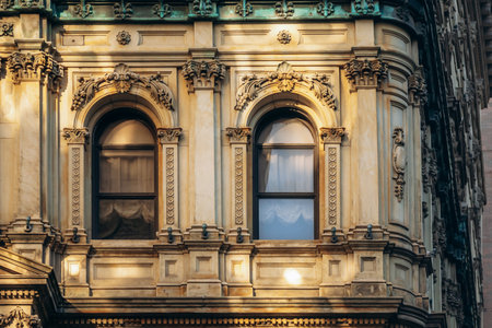 Ornate historic facade on Rue Saint-Jacques with arched windows and detailed stonework in downtown Montrealの写真素材