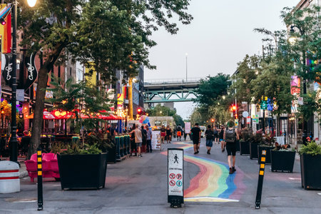 Montreal, Canada - August 12, 2025: Sainte-Catherine Street, Village (Gay Village) with rainbow...