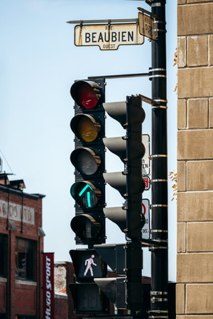 Montreal, Canada - August 12, 2025: Classic traffic lights and street sign on Rue Beaubien Ouest, Little Italyのeditorial素材