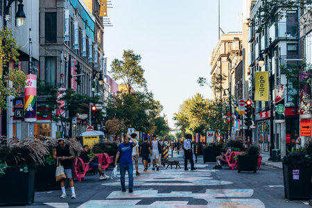 Montreal, Canada - August 12, 2025: Sainte-Catherine Street, Village (Gay Village) with rainbow...